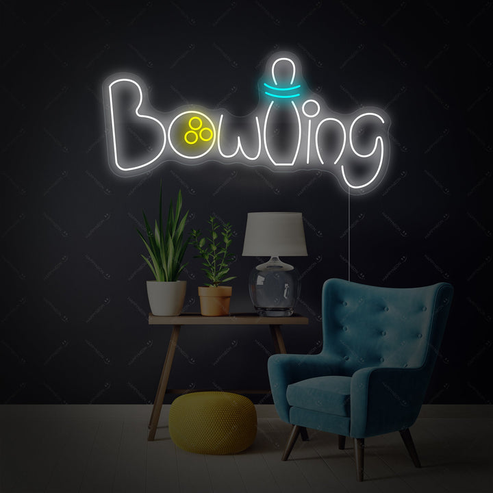 Close up view of the 'Bowling' neon sign mounted on a clear backboard and illuminated against a dark brick wall.