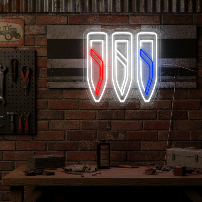 Red, white, and blue Buick tri-shield neon sign mounted on a brick wall, perfect for classic American car enthusiasts and garage decor.
