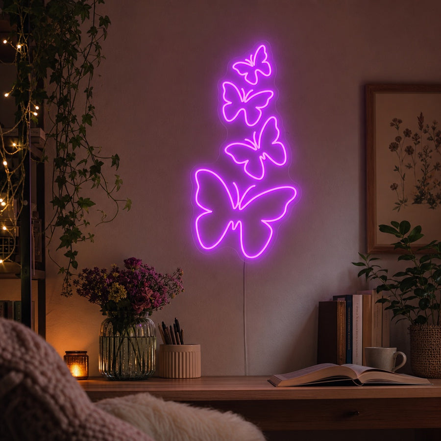 A cozy living room featuring the glowing Butterflies Neon Sign mounted above a plush armchair, casting a warm light.