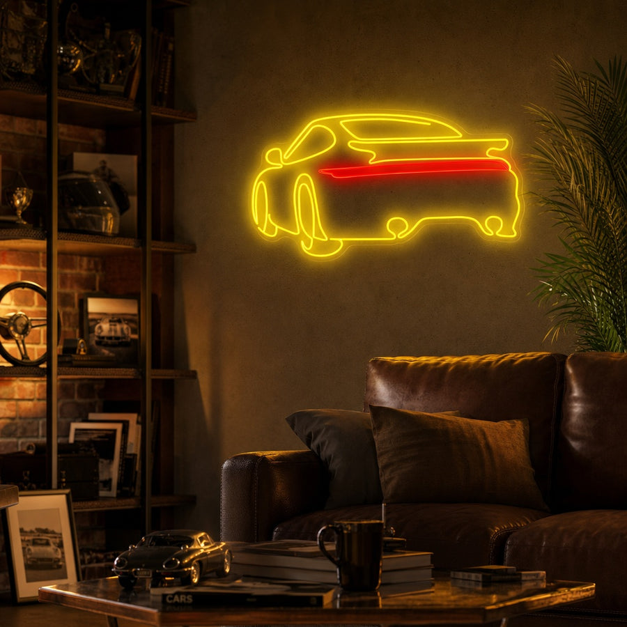 Vibrant yellow glowing neon sign in the shape of a classic Porsche 911 sports car, mounted on a brick wall in a modern garage interior mockup.
