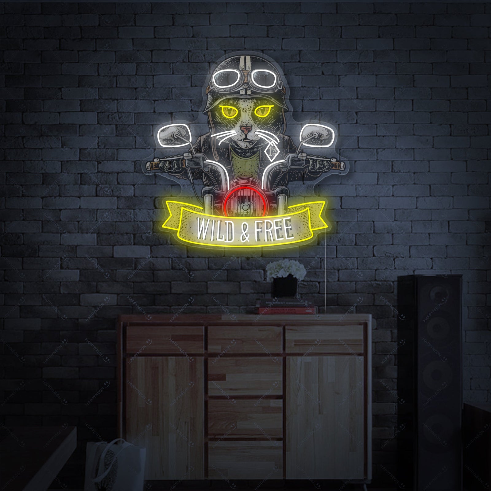A glowing neon sign displaying a detailed design of a cat riding a motorcycle, rendered in orange and white light against a slightly blurred brick wall background.
