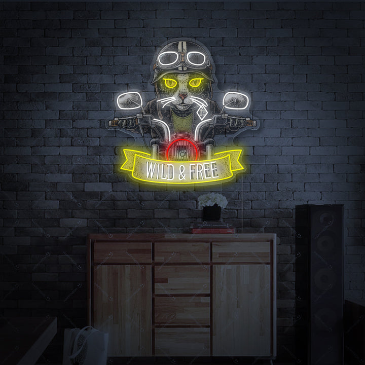 A glowing neon sign displaying a detailed design of a cat riding a motorcycle, rendered in orange and white light against a slightly blurred brick wall background.