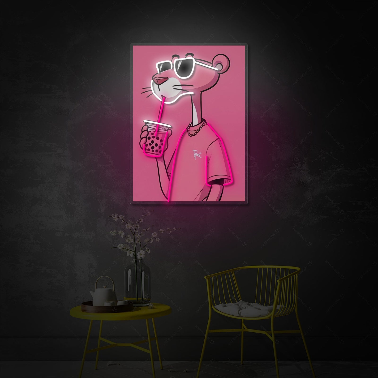 A glowing neon sign on a wall depicting the Pink Panther character wearing sunglasses and holding a bubble tea with a large straw, shown in a cozy room at night.