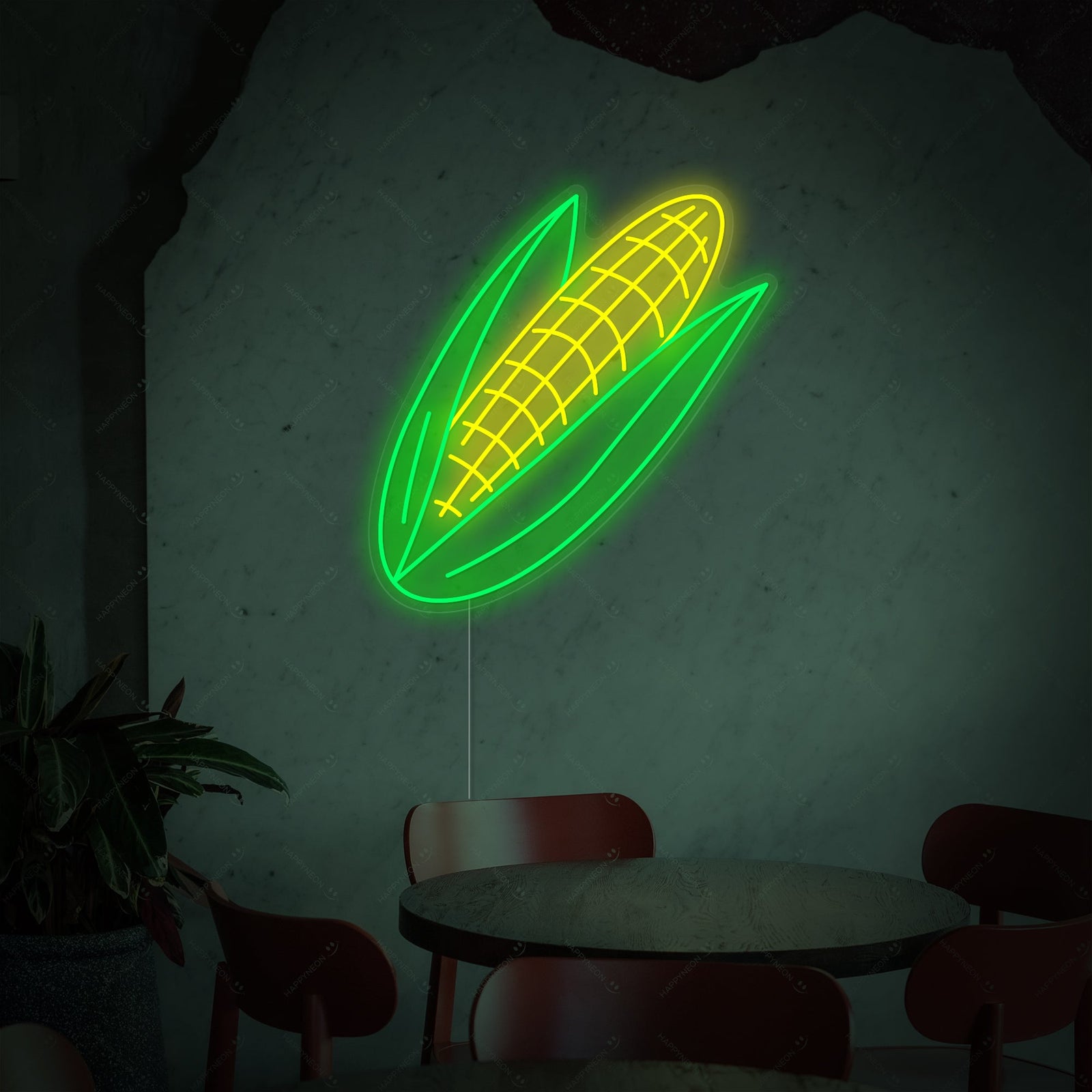 A front view of the 'Corn' neon sign, showcasing the detailed tubing forming the shape of an ear of corn with husks, against a plain background, illustrating the design detail and fabrication.