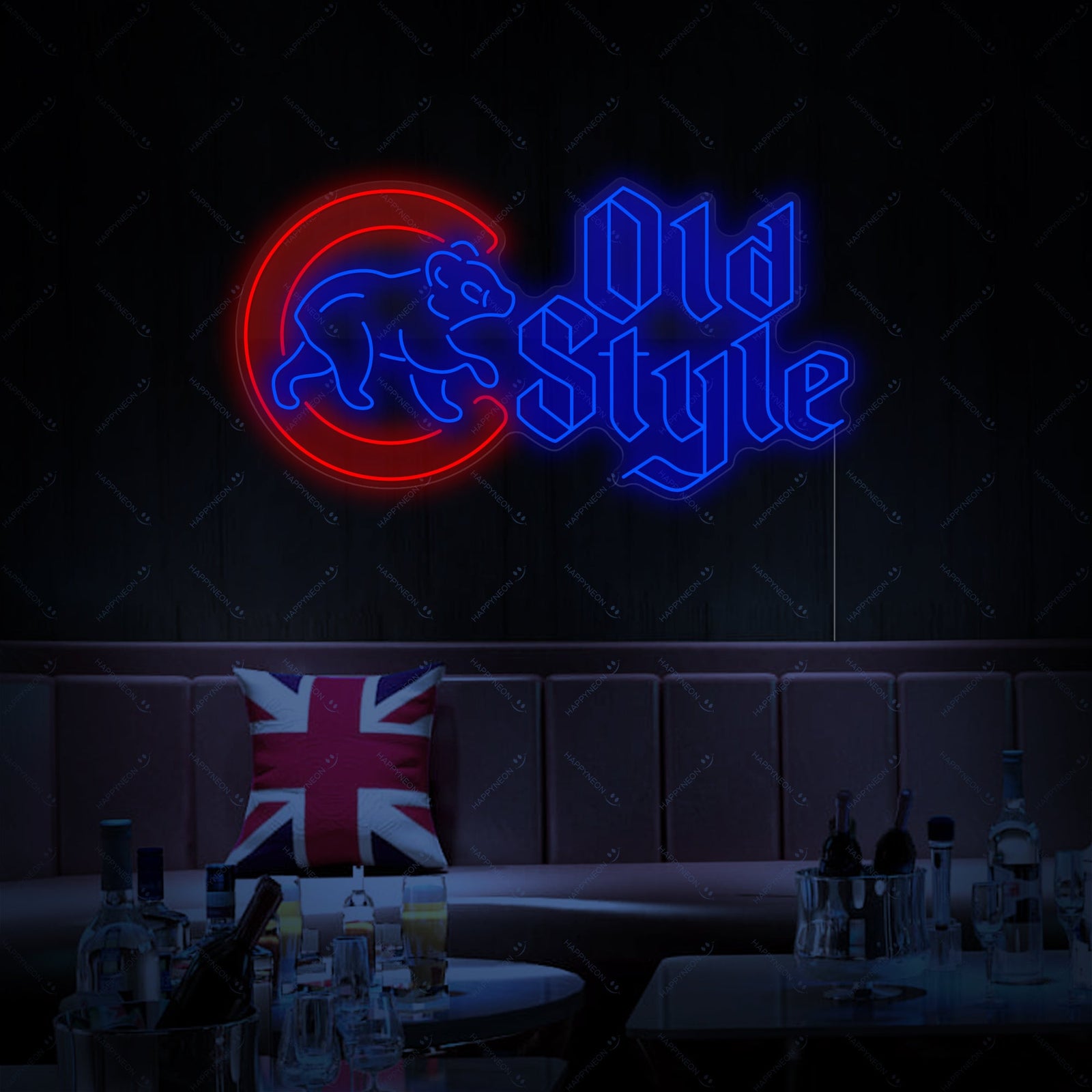 A detailed view of the illuminated 'Cubs Walking Bear Beer' neon sign, showcasing the colorful tubing and clear backboard design on a dark wood background.