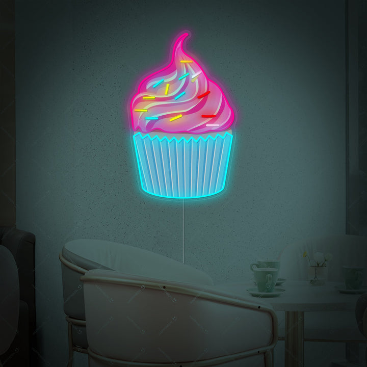 Detailed shot of the 'Cupcake' neon sign featuring colorful graphic details and glowing neon outlines, showing the acrylic backing.