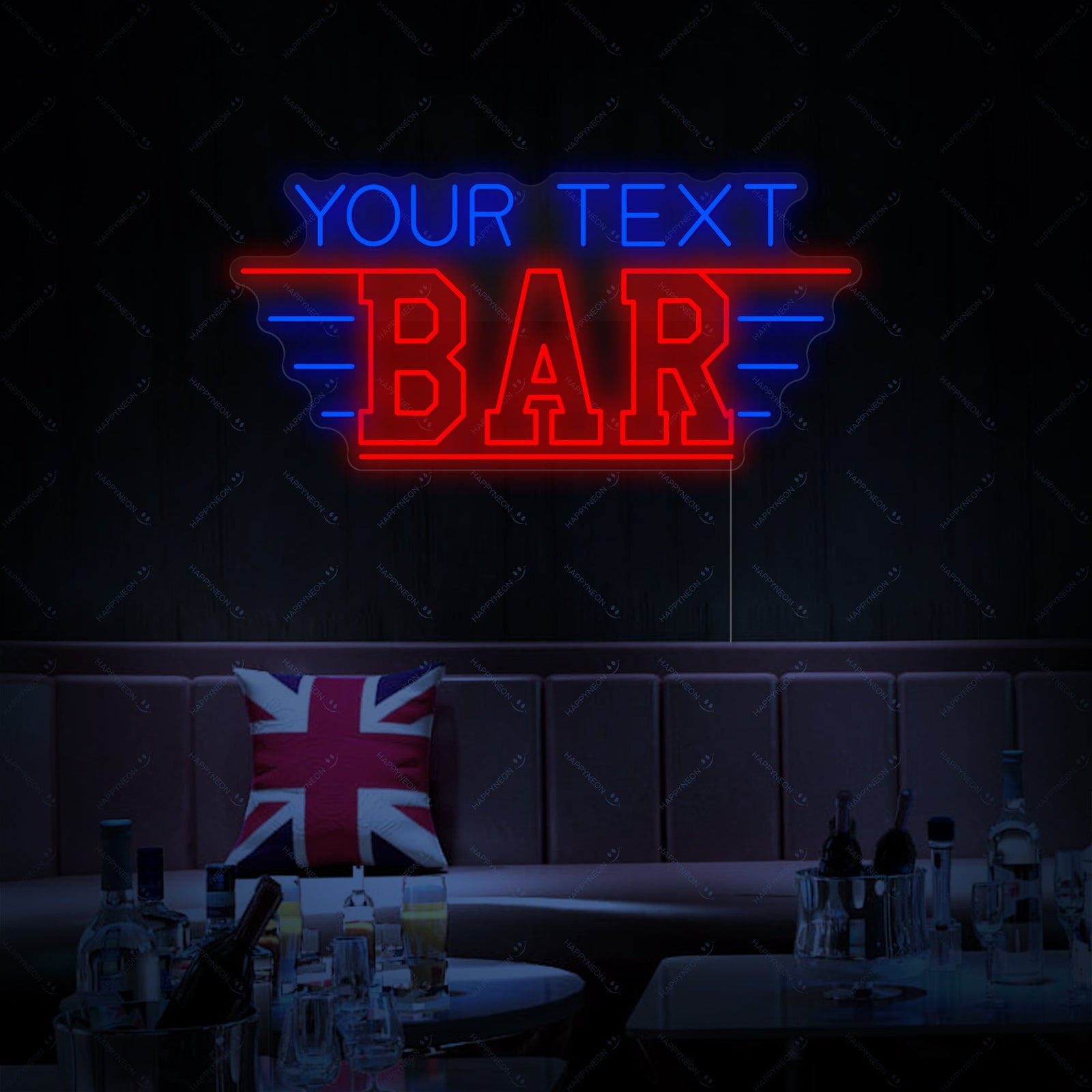Wide-angle photograph showing the vibrant 'CUSTOM BAR' neon sign glowing on a textured stone wall, casting a warm light over a cozy home bar setup with a leather armchair and patterned rug.