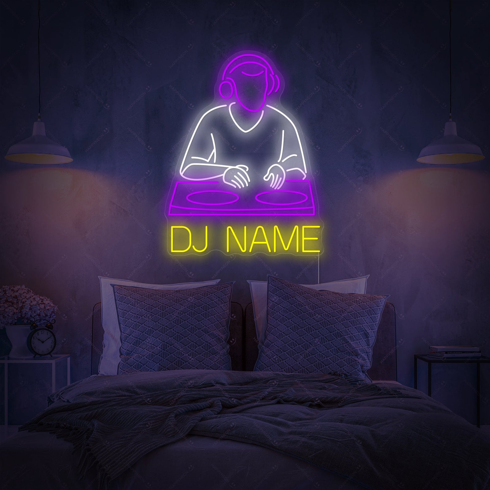 A custom neon sign displaying 'DJ NAME' in a blue, retro-futuristic font against a dark, brick bedroom wall, hanging above a desk with a gaming chair.