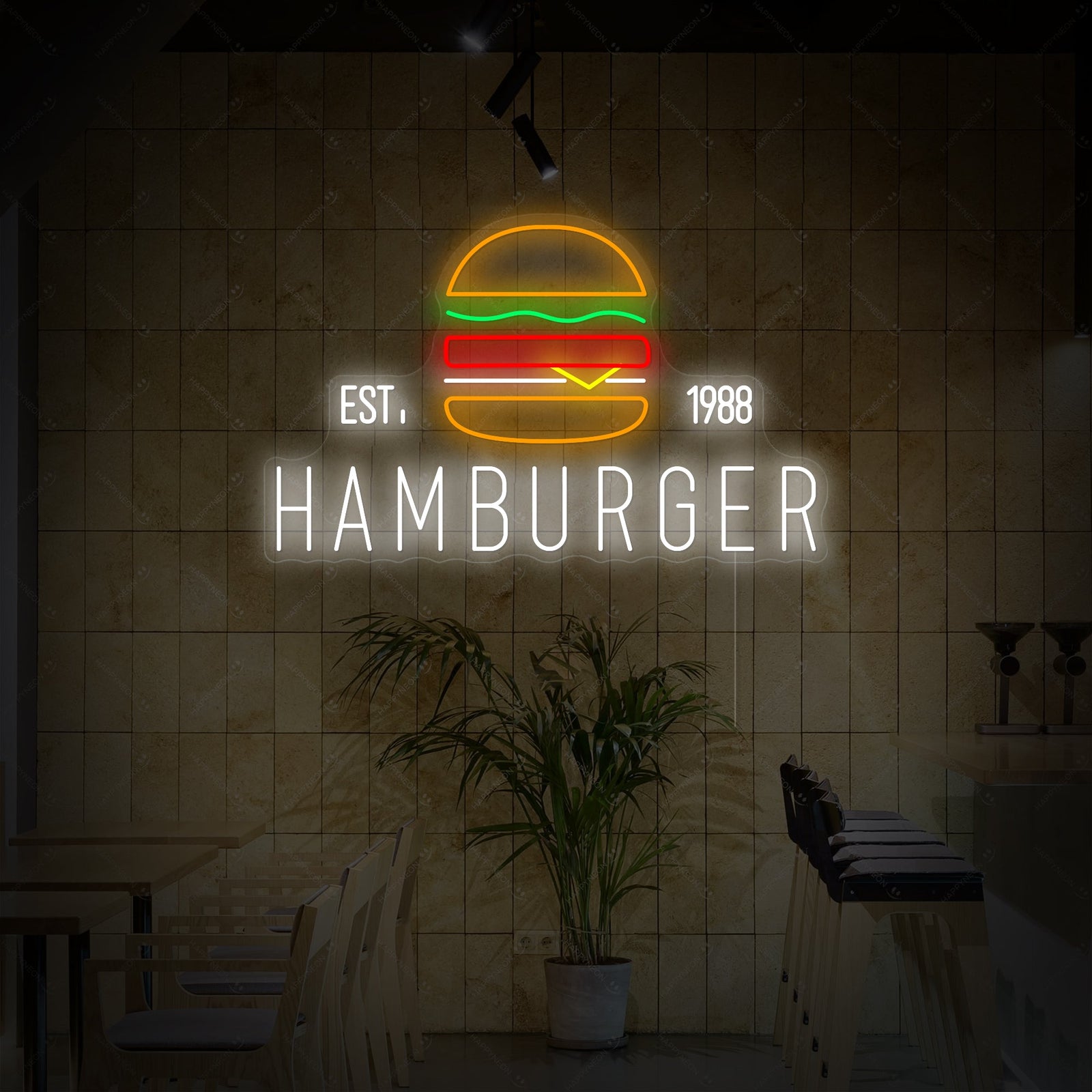 A glowing neon sign depicting a detailed hamburger, mounted on a rustic wooden wall above a restaurant booth.