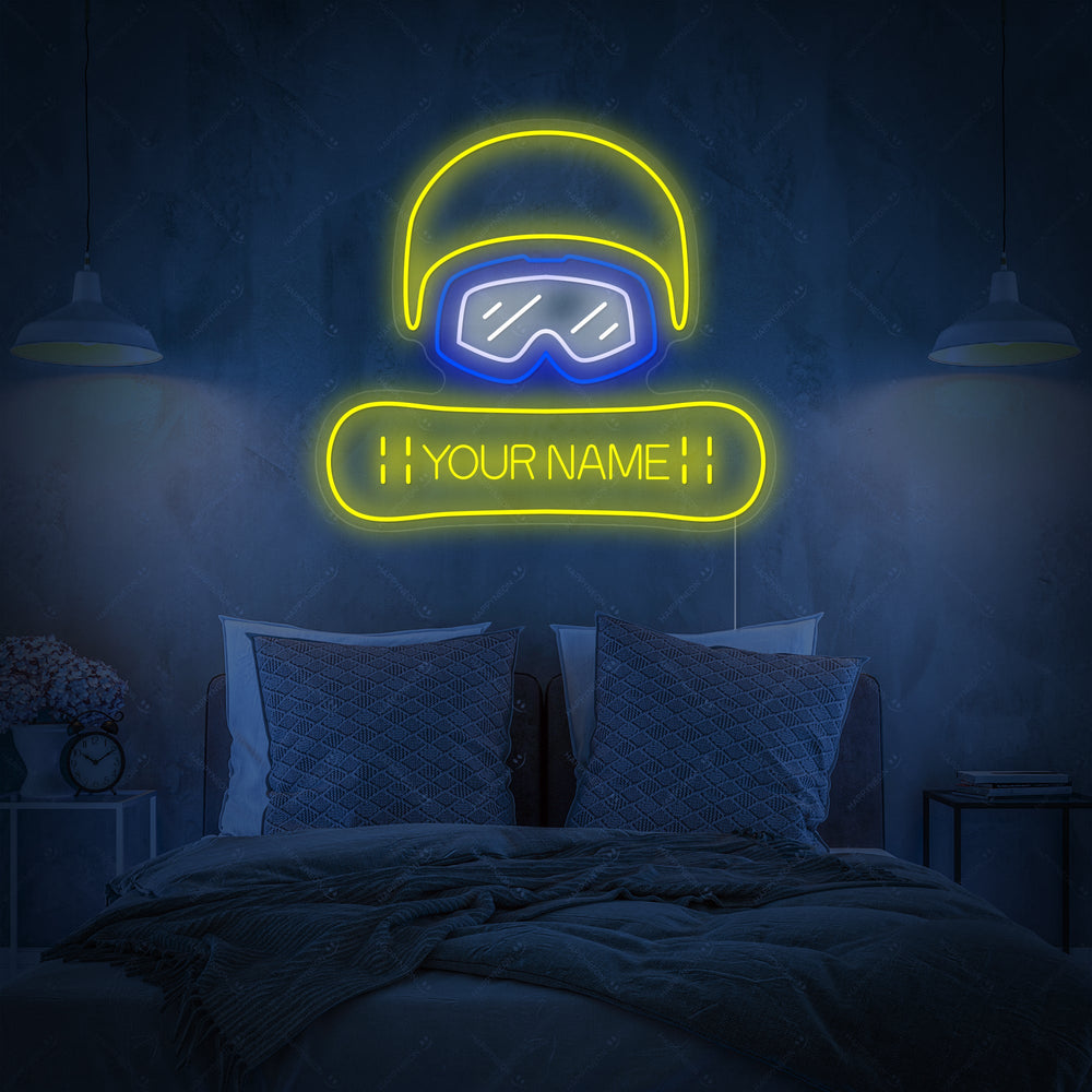 A mockup of the Custom Snowboard Neon Sign displayed over a bed, featuring the text 'YOUR NAME' on the snowboard graphic.