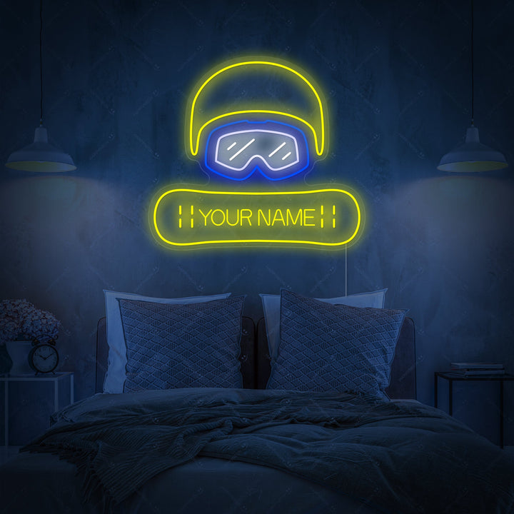 A mockup of the Custom Snowboard Neon Sign displayed over a bed, featuring the text 'YOUR NAME' on the snowboard graphic.