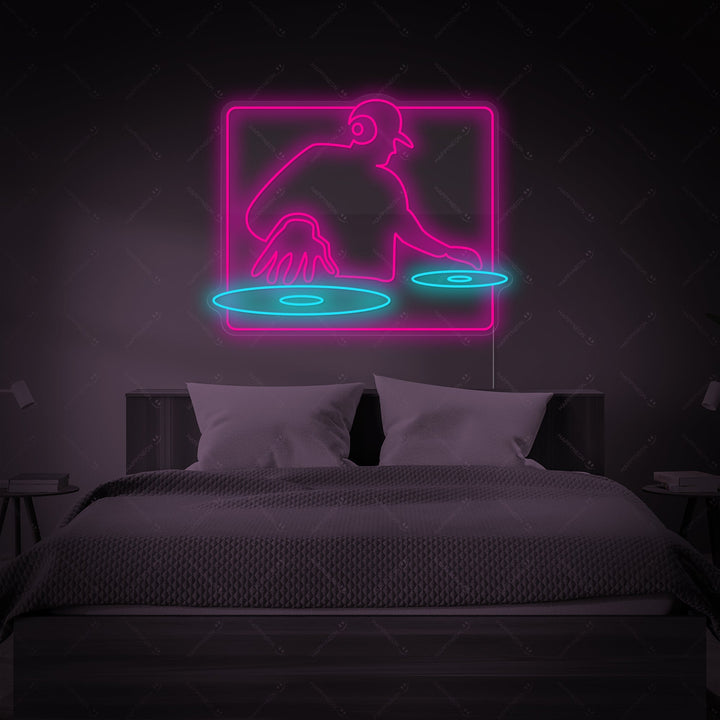 A detailed depiction of the 'DJ Playing' neon sign featuring a silhouette of a DJ at turntables and headphones, mounted on a dark surface and emitting a strong glow.