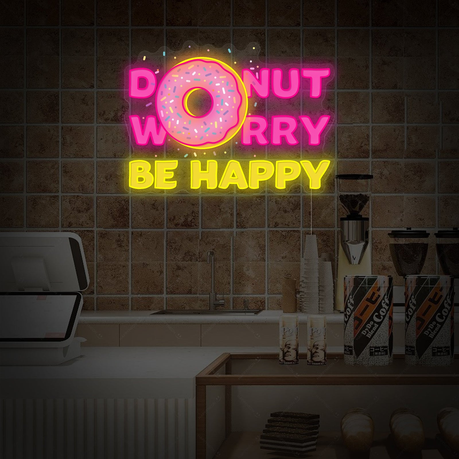 A close-up view of the glowing 'Donut Do Not Worry Be Happy' neon sign, showing the detailed donut graphic and cursive font against a plain background.