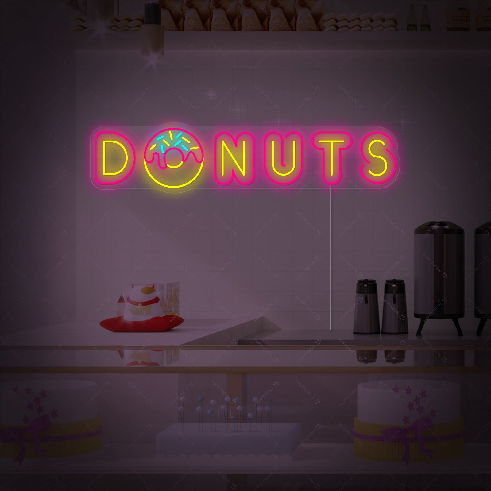 A vibrant pink "DONUTS" neon sign glowing brightly on a detailed brick background.