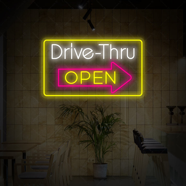 The graphic design for the 'Drive Thru Open' neon sign, showing the red illuminated lettering on a dark, out-of-focus background.