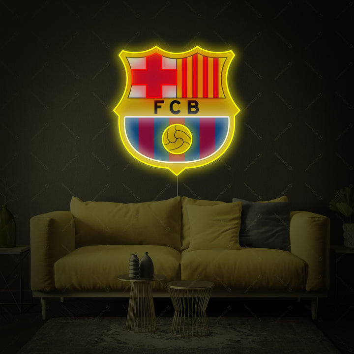 Detailed close-up of the illuminated FC Barcelona crest neon sign
