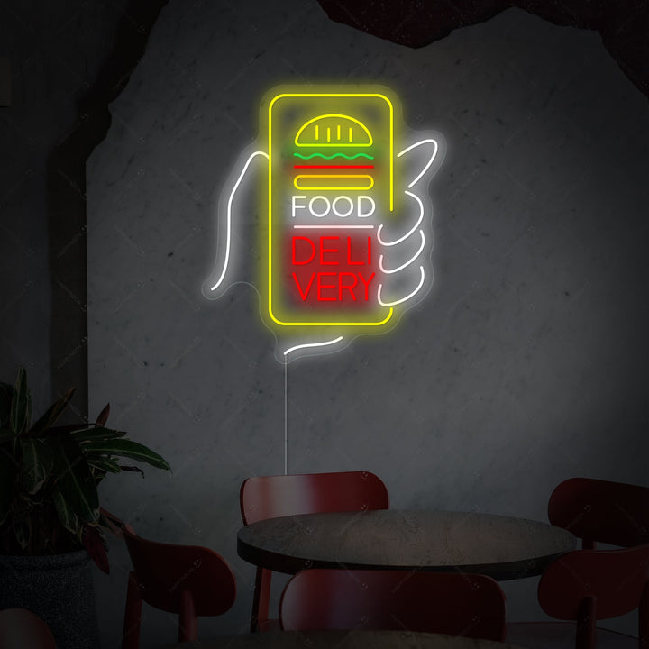 A glowing blue 'Food Delivery' neon sign featuring a scooter icon, mounted on a wall with a power cord visible.