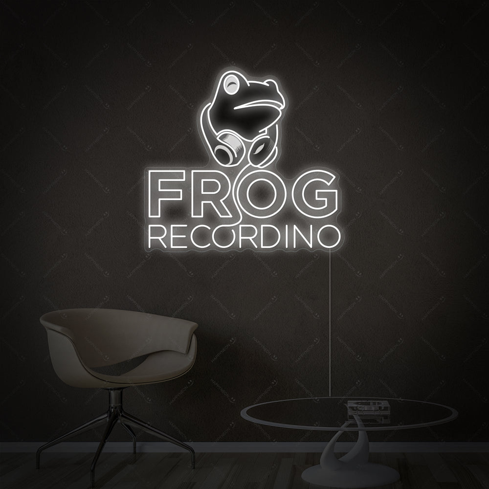 Graphic illustration of a neon sign design featuring a frog with headphones at a recording console, with the text 'FROG RECORDING' in glowing letters.