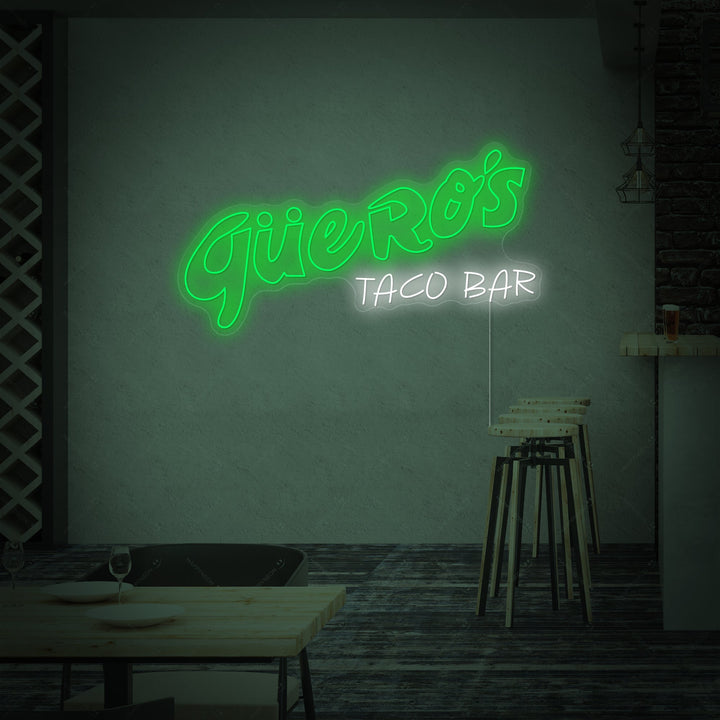 Closeup of the 'Guero's Taco Bar' neon sign design details against a dark background.