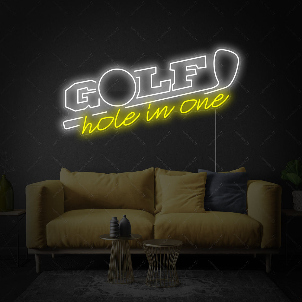 A close-up photograph of the 'Golf Hole In One' neon sign showing the realistic tubing and mounting backboard against a textured wall.