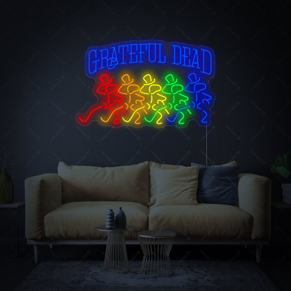 Grateful Dead neon sign with skull logo lit up in blue and red on a rustic brick wall.