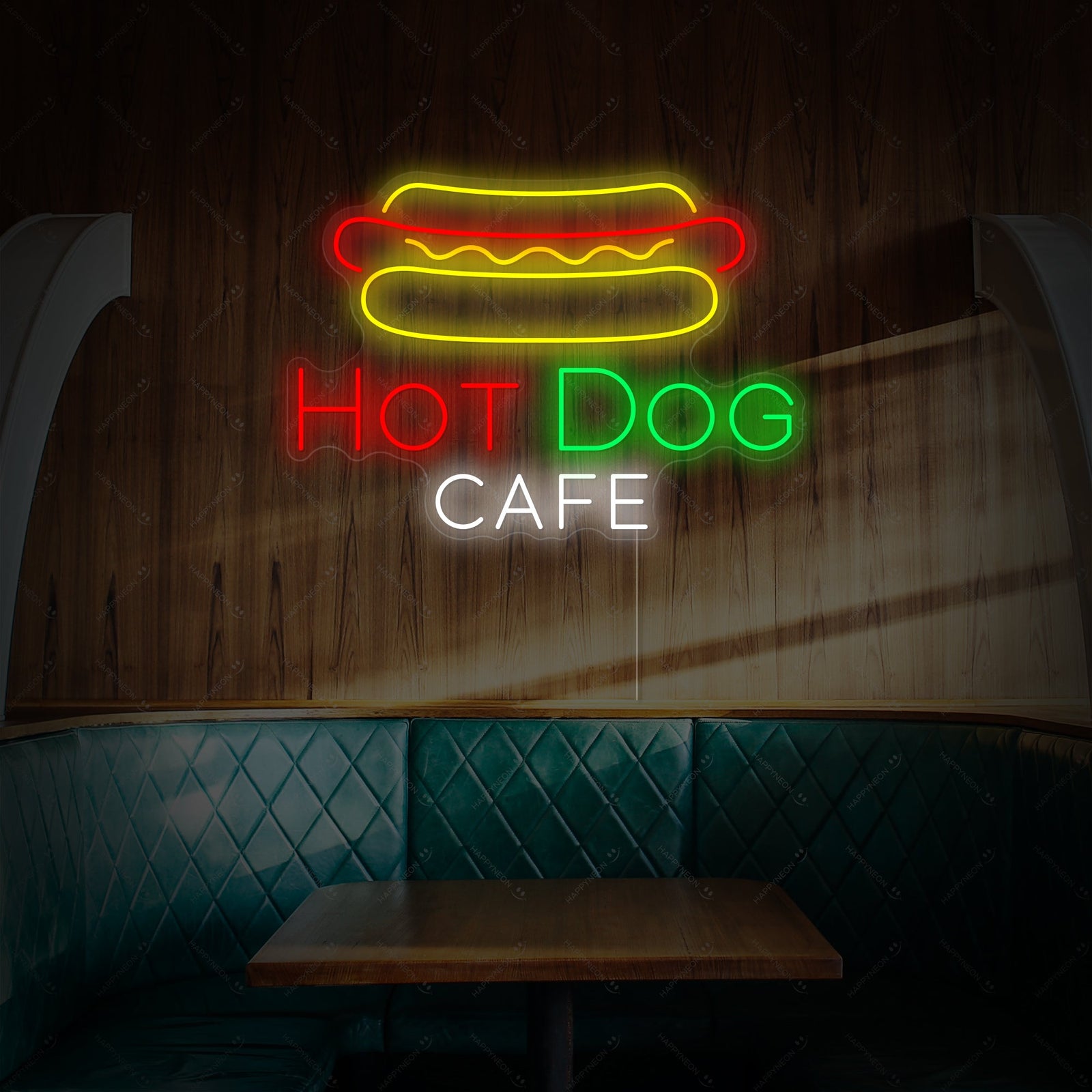 A close-up of the glowing "Hotdog Cafe" neon sign mounted on an acrylic backer.