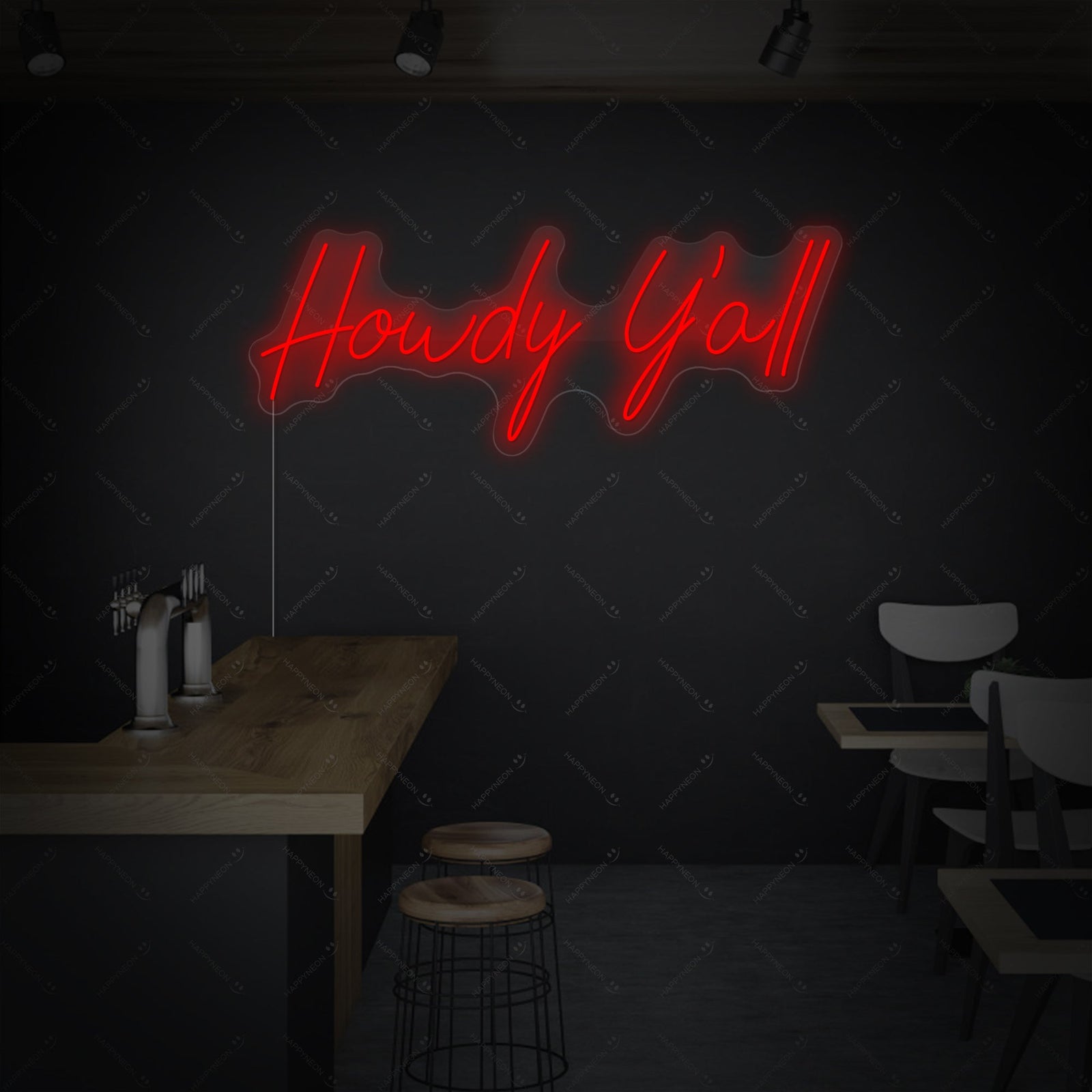 The 'Howdy Y'all' neon sign glowing in bright yellow, mounted on a clear acrylic backing which is cut to shape around the cursive text.