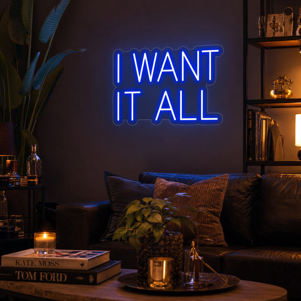 I Want It All inspirational quote neon sign glowing on a textured bedroom wall with modern decor