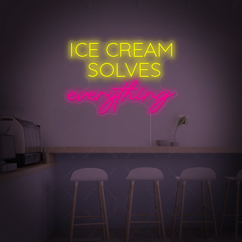 The 'Ice Cream Solves Everything' neon sign with pink and blue glowing tubing set against a clean, blurred interior background.