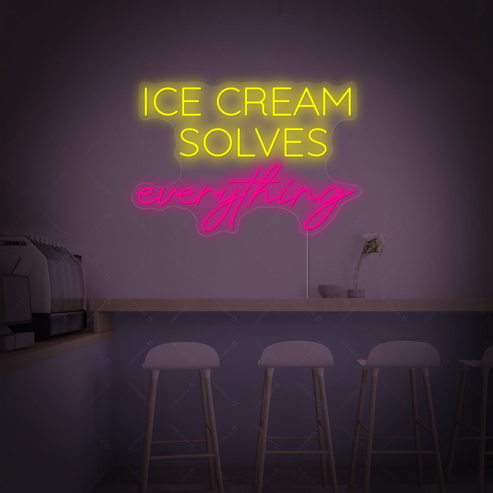 The 'Ice Cream Solves Everything' neon sign with pink and blue glowing tubing set against a clean, blurred interior background.