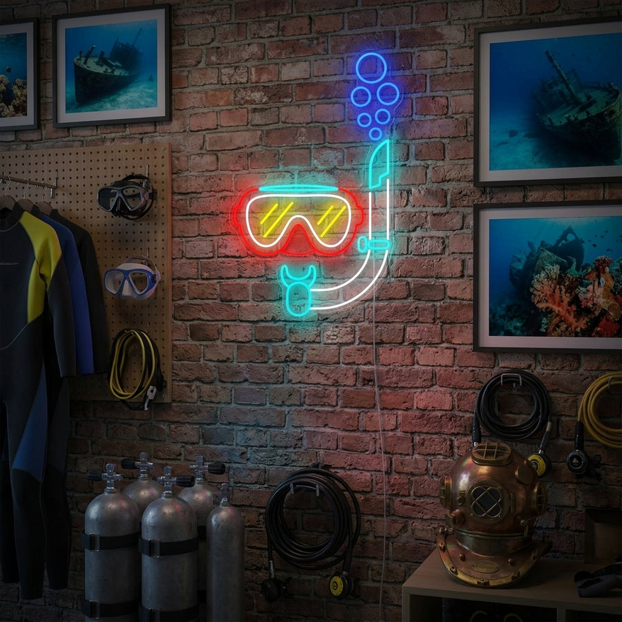 A vibrant 'Diving Snorkel Mask' neon sign hanging above a shelf in a beach-themed room.