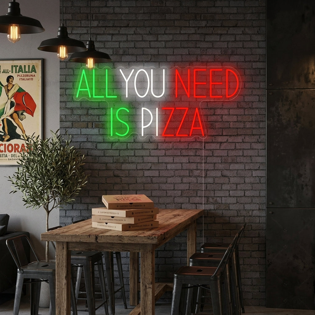 A cozy kitchen setting with the lit 'All You Need Is Pizza' neon sign hanging above a rustic wooden table.