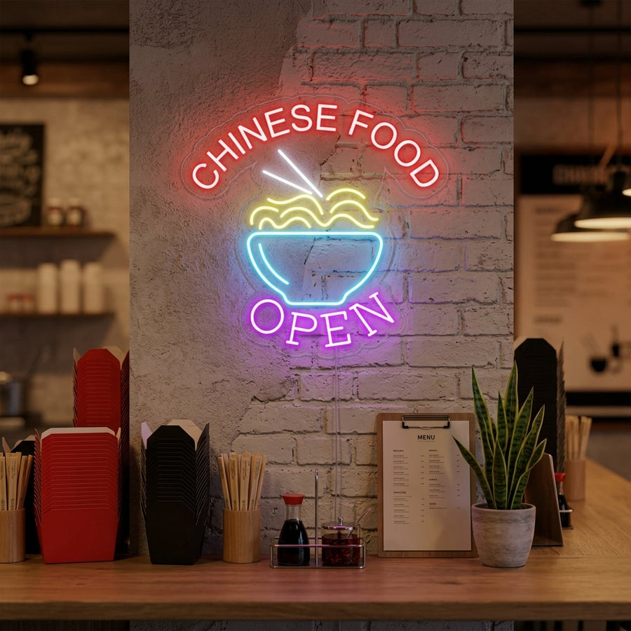 A glowing 'Chinese Food Open Noodles' neon sign illuminating a modern restaurant interior.