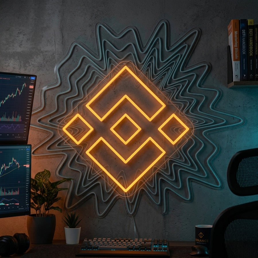 BNB Binance neon sign displayed above a sleek desk setup.