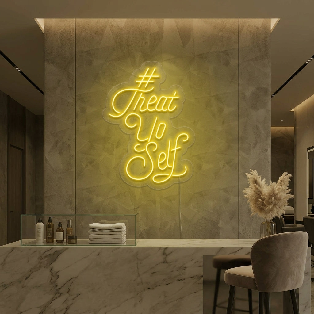 Close-up photograph of a brightly lit 'Treat Yo Self' neon sign, casting a warm pink glow in a contemporary living room setting. The neon sign is mounted above a sleek sideboard with potted plants.