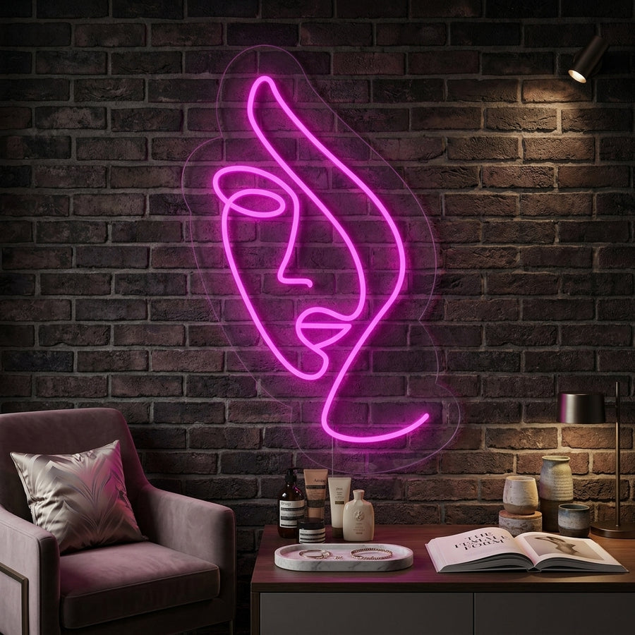 Abstract Lady Face neon wall sign illuminated in blue in a modern apartment setting