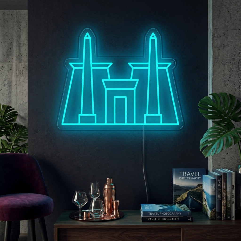 A lifestyle photograph of an illuminated orange neon sign depicting the ancient Egyptian Karnak Temple complex mounted on a modern dark blue living room wall above a grey sofa and potted plants.