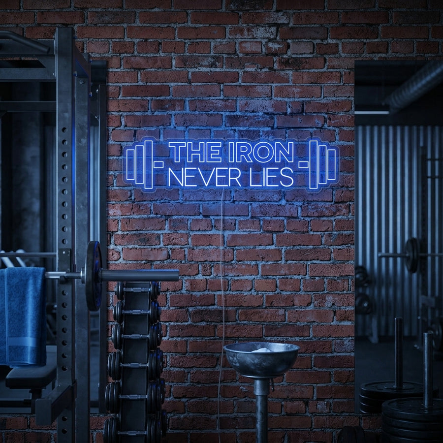 A fitness enthusiast sits in a home gym setting, looking motivated with the glowing 'The Iron Never Lies' neon sign displayed on a brick wall behind them.