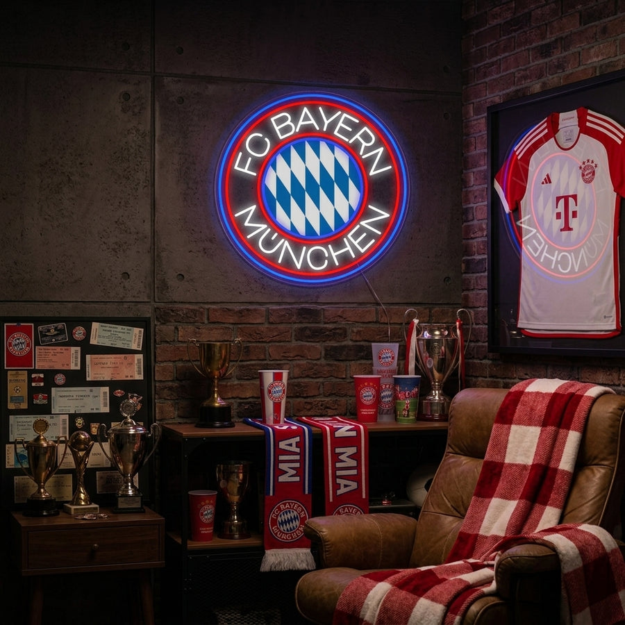 FCBM Football neon sign glowing on a textured brick wall in a cozy fan cave environment.