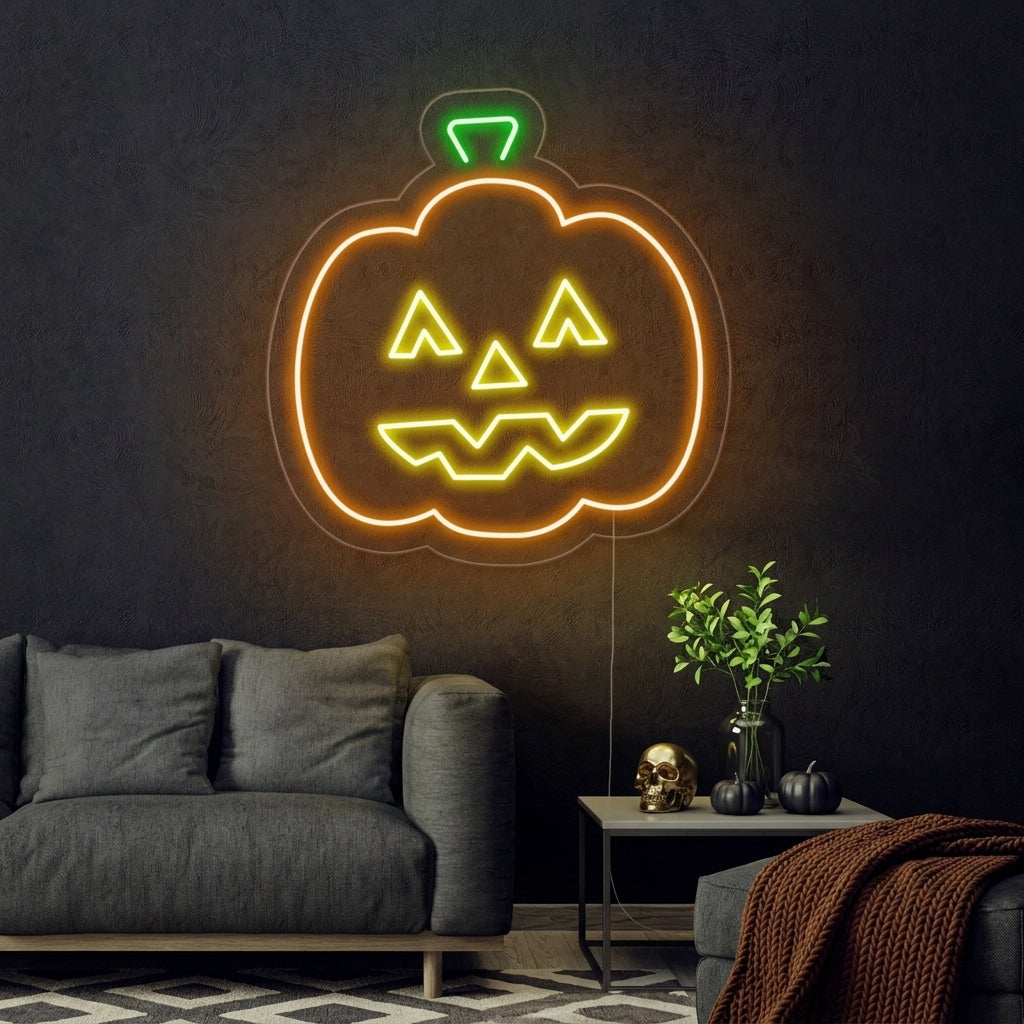 Handcrafted neon wall sign depicting a classic glowing orange Halloween jack-o'-lantern mounted on a clear acrylic background.