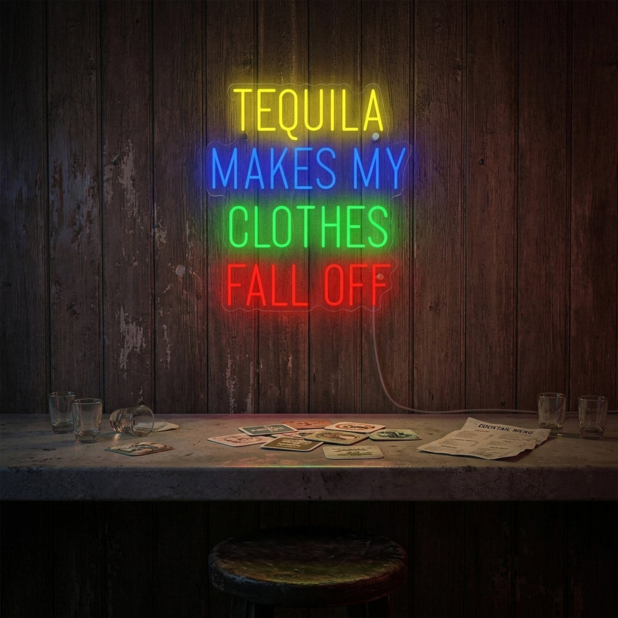 A 'Tequila Makes My Clothes Fall Off' neon sign glowing on a wall.