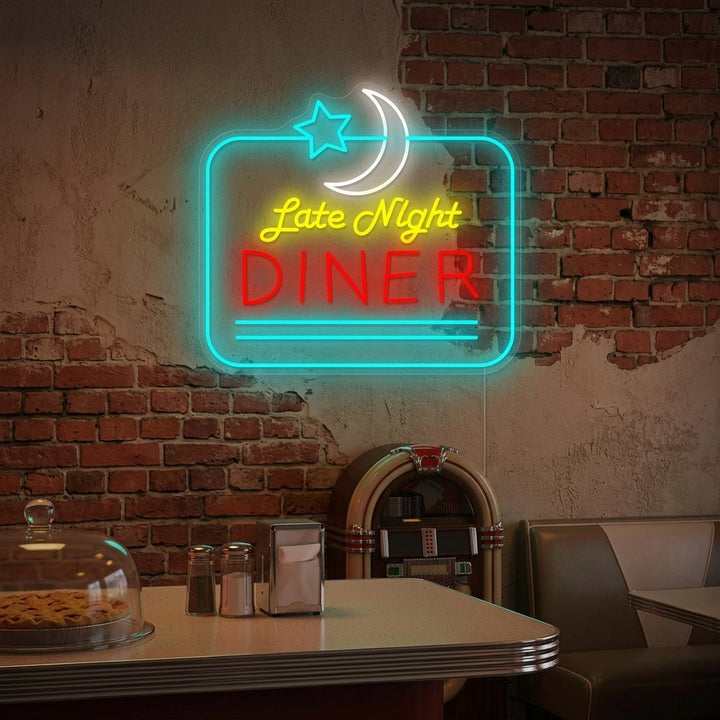 A cozy, vintage-style home kitchen illuminated by the glowing 'Late Night Diner' neon sign mounted on a brick wall above a classic vinyl booth.