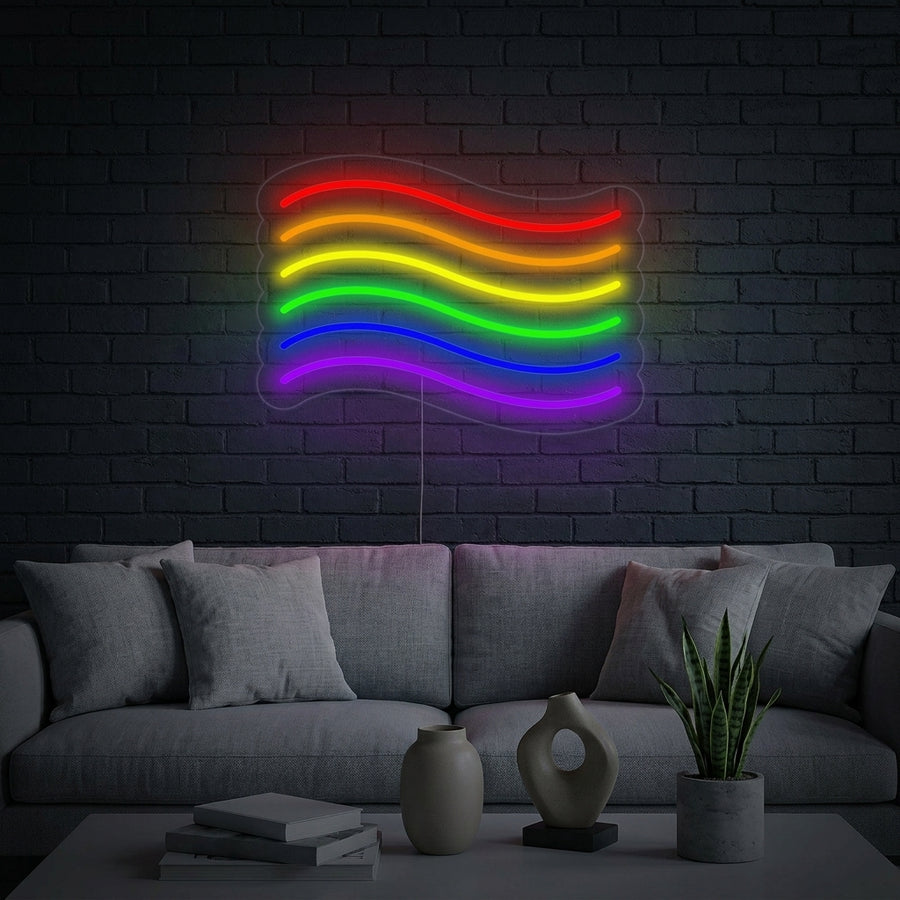 Pride Rainbow Flag neon sign glowing in a stylish, cozy living room above a couch, creating an inclusive atmosphere.