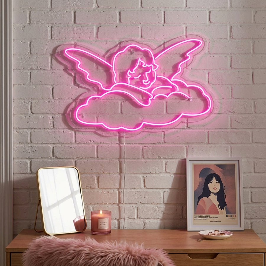 Angel Baby neon sign glowing on a bedroom wall.