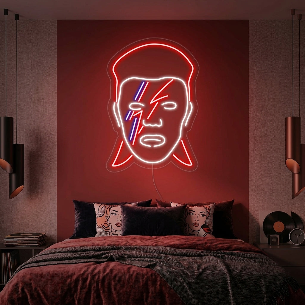 David Bowie stylized face neon sign glowing in a bedroom setting