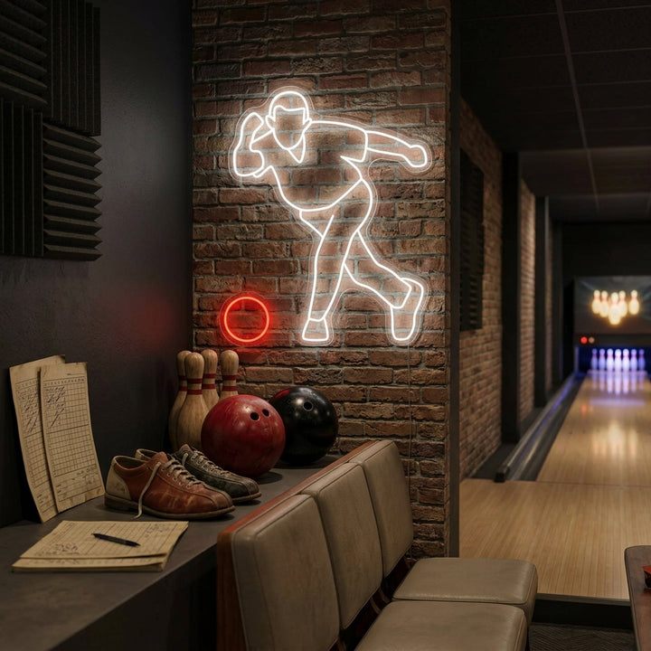 A glowing Throwing Bowling neon sign installed on a textured brick wall, illuminating a cozy home game room or bar setting.