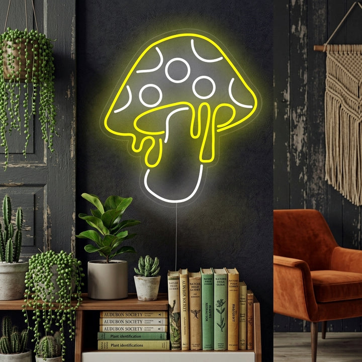 A vibrant 'Mushroom Dripping' neon sign glows on a textured wall within a styled room, casting colorful light and creating an inviting ambiance.