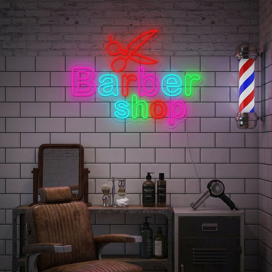 A vibrant 'Barber Shop' neon sign featuring a glowing barber pole icon and the text 'BARBER OPEN' illuminating a modern barbershop interior.