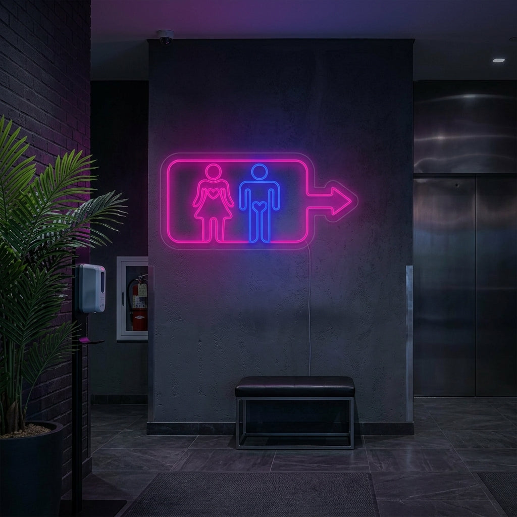 A lifestyle photograph of a 'Men Women Toilet Washroom Wall' neon sign glowing above an elevator call button in a modern building lobby.