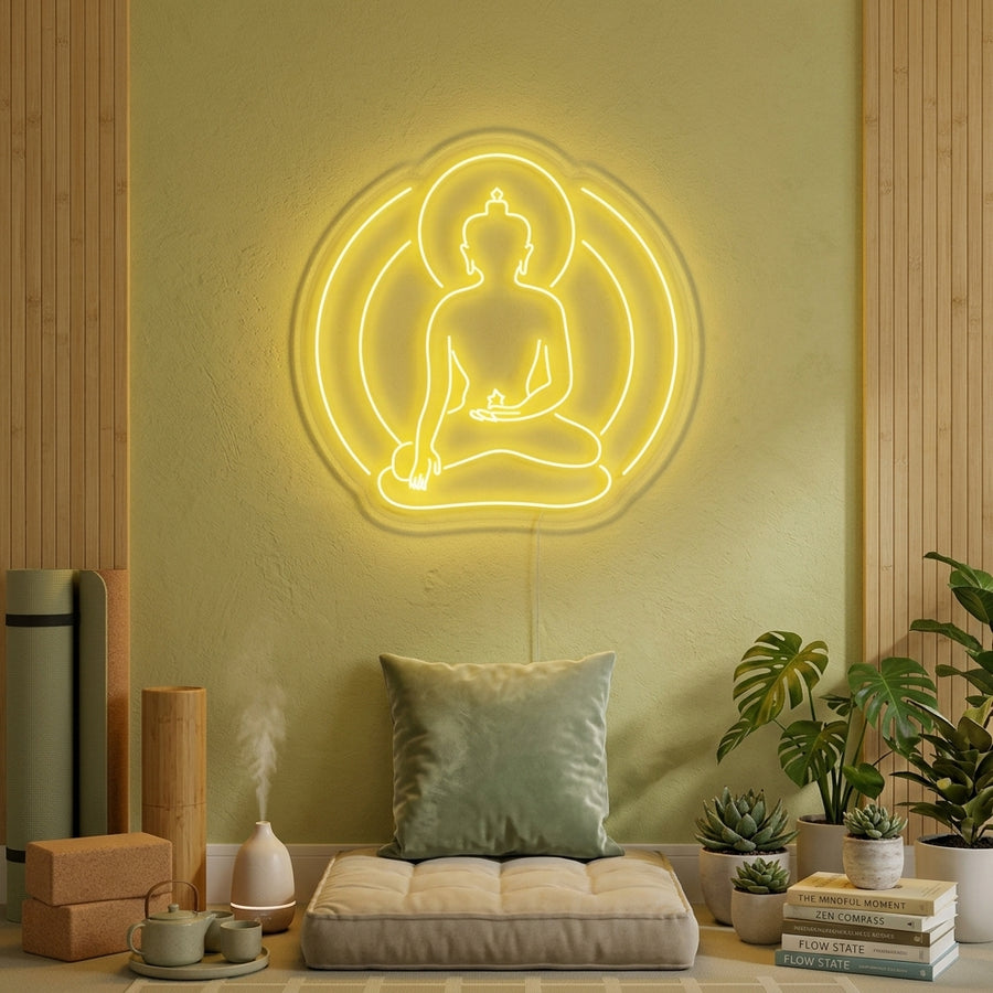 Buddha Yoga neon sign glowing softly on a textured wall in a peaceful meditation room setting.